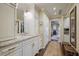 Bright bathroom featuring white cabinets, granite counters, double vanity, and walk-in closet at 4084 Columns Dr, Marietta, GA 30067