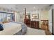 Spacious Primary bedroom featuring a large canopy bed and hardwood floors at 4084 Columns Dr, Marietta, GA 30067