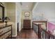 Bright second floor hallway with hardwood floors, wainscotting, and transom windows at 4084 Columns Dr, Marietta, GA 30067