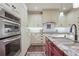 Bright kitchen with granite countertops, stainless steel appliances and white custom cabinetry at 4084 Columns Dr, Marietta, GA 30067