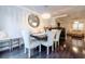 Elegant dining room with modern chandelier, stylish mirror, and comfortable seating for Gathering gatherings at 1005 Brighton Pt, Atlanta, GA 30328