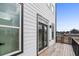 View of the exterior balcony with black metal railing, accessible from the modern home at 1084 Brookglynn Trce, Decatur, GA 30032