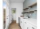 Butler's pantry bar area with a small wine fridge, shelves, and a sink at 1084 Brookglynn Trce, Decatur, GA 30032