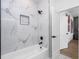 Bathroom featuring a tub, shower with marble tile, and modern fixtures at 1084 Brookglynn Trce, Decatur, GA 30032