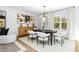 Modern dining room featuring neutral decor, contemporary lighting, and a light-colored rug at 1084 Brookglynn Trce, Decatur, GA 30032
