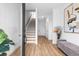 Bright entryway with hardwood floors, stairs, and modern decor at 1084 Brookglynn Trce, Decatur, GA 30032