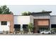 Commercial building featuring a modern facade with a combination of white and wood paneling and covered entrance at 1084 Brookglynn Trce, Decatur, GA 30032