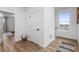 Inviting hallway with wood floors leading to the living areas and bedrooms at 1084 Brookglynn Trce, Decatur, GA 30032