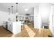 Bright kitchen features a large center island with pendant lighting and an open floor plan at 1084 Brookglynn Trce, Decatur, GA 30032