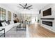 Open-concept living room featuring fireplace, contemporary decor, and a connected dining area at 1084 Brookglynn Trce, Decatur, GA 30032