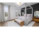 Main bedroom with a four-poster bed, dark accent wall, and access to private balcony at 1084 Brookglynn Trce, Decatur, GA 30032