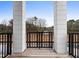 Modern outdoor patio overlooking a construction site and wooded area at 1084 Brookglynn Trce, Decatur, GA 30032