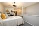 Cozy bedroom featuring neutral walls, gray carpeting, a decorative ceiling fan, and unique shelving at 3655 Habersham Ne Rd # 344, Atlanta, GA 30305