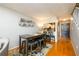 Open-concept dining area with modern table, seating, and decor, adjacent to the kitchen and entryway at 3655 Habersham Ne Rd # 344, Atlanta, GA 30305