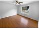 Large bedroom with hardwood floors and a bright window providing natural light at 5920 Rock Rd, Union City, GA 30291