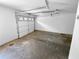 An empty, one car garage with a concrete floor at 5920 Rock Rd, Union City, GA 30291