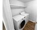 Laundry room including washer, dryer, and shelving at 5920 Rock Rd, Union City, GA 30291