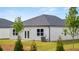 Lawn and patio of a home's backyard, creating a tranquil outdoor space at 8601 Secretariat Dr, Lithonia, GA 30058