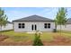 Backyard featuring a lawn, small patio, perfect for outdoor relaxation and enjoyment at 8601 Secretariat Dr, Lithonia, GA 30058