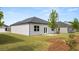 Well-maintained backyard with a lawn, patio, and landscaping, ideal for outdoor living at 8601 Secretariat Dr, Lithonia, GA 30058