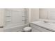 Clean bathroom featuring a tub, toilet, and a vanity with marble counter at 8601 Secretariat Dr, Lithonia, GA 30058