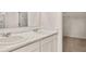 Bathroom featuring dual sinks with white countertops, and a mirror at 8601 Secretariat Dr, Lithonia, GA 30058