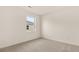 Bedroom featuring neutral carpet and a window that provides natural light at 8601 Secretariat Dr, Lithonia, GA 30058