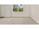 Bedroom featuring plush carpeting, a window, and ample natural light at 8601 Secretariat Dr, Lithonia, GA 30058