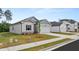 Charming home boasts a manicured lawn, two-car garage, and a welcoming facade at 8601 Secretariat Dr, Lithonia, GA 30058
