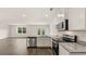 Contemporary kitchen featuring stainless steel appliances and granite countertops in a bright setting at 8601 Secretariat Dr, Lithonia, GA 30058
