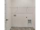 Laundry room with tile floor, shelving, and appliance connections at 8601 Secretariat Dr, Lithonia, GA 30058
