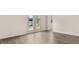Open living room showcasing beautiful hardwood flooring, French doors and bright, neutral paint at 8601 Secretariat Dr, Lithonia, GA 30058