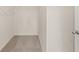 Walk-in closet featuring carpeted floors and shelves for ample storage at 8601 Secretariat Dr, Lithonia, GA 30058