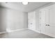 This unfurnished bedroom has neutral carpeting and large closets at 2150 Tidwell Ln # 5, Atlanta, GA 30318