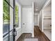 Bright entryway with hardwood floors, white trim, and a large window for natural light at 2150 Tidwell Ln # 5, Atlanta, GA 30318