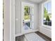 Entryway featuring dark wood floors, a patterned rug, and a door with window panels at 2150 Tidwell Ln # 5, Atlanta, GA 30318