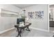 Bright home office featuring modern decor, a sleek desk, and an adjacent bathroom at 2150 Tidwell Ln # 5, Atlanta, GA 30318