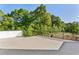 Expansive outdoor patio overlooking a road and lush green trees with construction site in the background at 2150 Tidwell Ln # 5, Atlanta, GA 30318