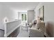 A second-story sitting room with French doors and neutral decor at 2150 Tidwell Ln # 5, Atlanta, GA 30318