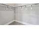 A large walk-in closet with white walls and plenty of hanging space at 2150 Tidwell Ln # 5, Atlanta, GA 30318