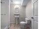 Bathroom featuring a walk-in shower, pedestal sink, and toilet at 3930 Buck Rd, Powder Springs, GA 30127