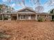 Charming brick ranch-style home with a covered porch and decorative railings at 3930 Buck Rd, Powder Springs, GA 30127