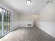 Living area with tile floors, wainscoting, and sliding glass doors at 3930 Buck Rd, Powder Springs, GA 30127