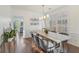 Bright dining room with a rustic table, shuttered windows, and decorative accents at 807 Plaintain Dr, Woodstock, GA 30188