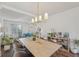 Dining area with a large table, stylish chairs, and bright natural light at 807 Plaintain Dr, Woodstock, GA 30188