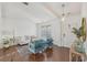 Inviting living room featuring hardwood floors, modern lighting, and comfortable seating at 807 Plaintain Dr, Woodstock, GA 30188