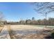 A sand volleyball court is located next to a community basketball court at 807 Plaintain Dr, Woodstock, GA 30188