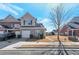 Charming two-story home featuring a neutral brick facade, attached garage, and manicured landscaping at 2555 Flat Shoals Rd # 1705, Atlanta, GA 30349