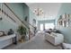 Inviting living room with vaulted ceilings, a decorative chandelier, and natural light at 2555 Flat Shoals Rd # 1705, Atlanta, GA 30349