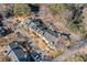 An aerial view showcases a condo complex, parking areas, mature trees, and well-maintained landscaping at 6420 Magnolia Way, Morrow, GA 30260